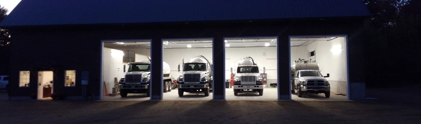 Best Septic Service garage with trucks